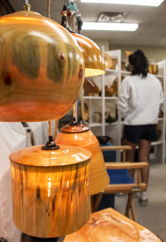 The CWP Woodworking display shows off the woodturning artistry of Charles W. Paul, who donated one of his lamps to raise funds.